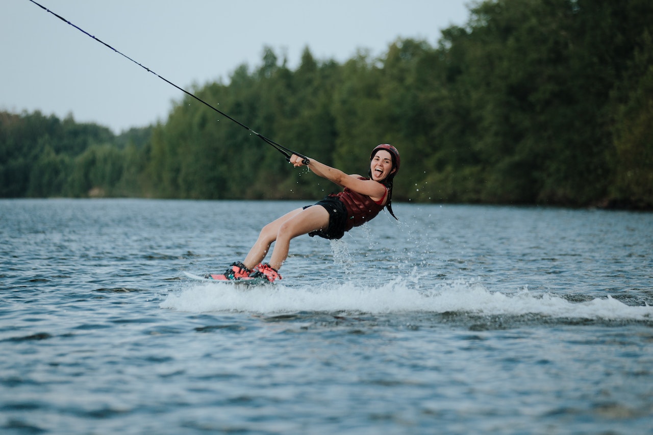 Adult woman is having fun on the lake